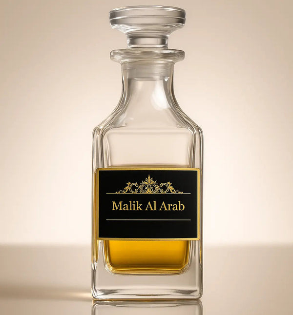 Glass bottle with a label reading 'Malik Al Arab' on a beige background