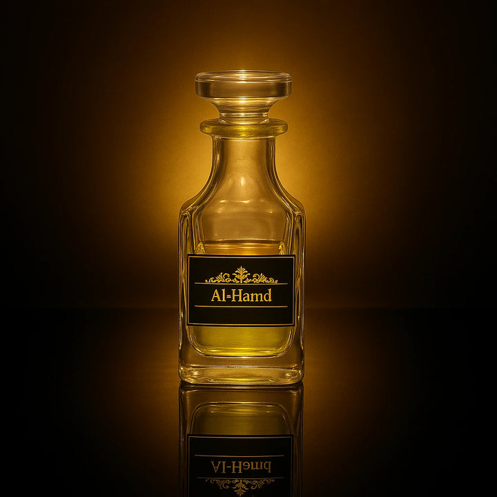 Glass bottle labeled 'Al-Hamd' on a reflective surface with a warm brown background