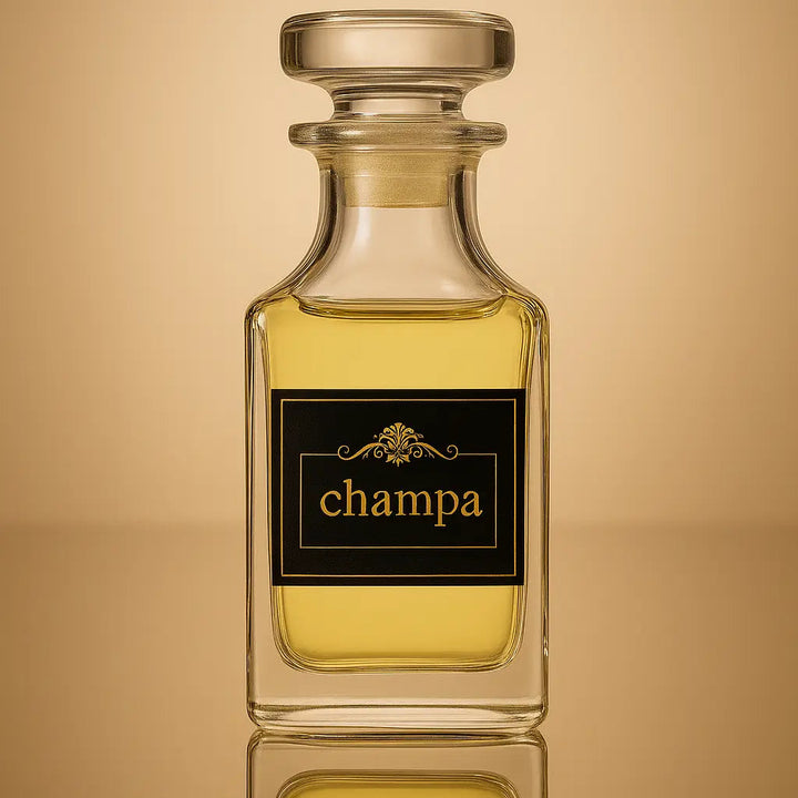 Perfume bottle labeled 'champa' on a reflective gold surface with a beige background