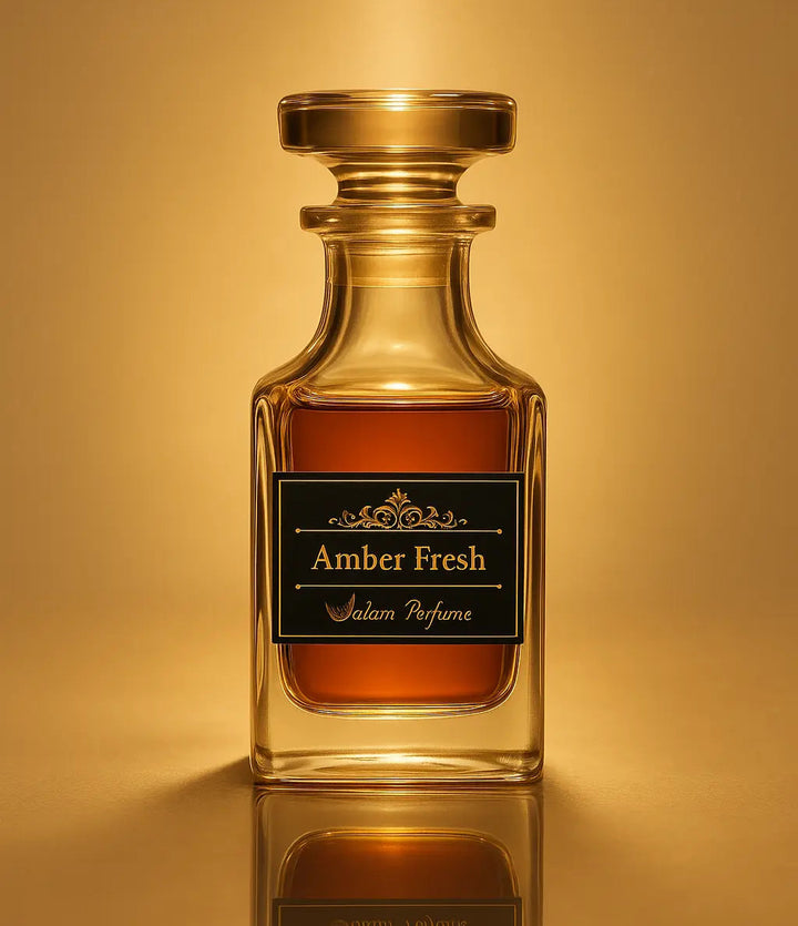 Amber Fresh perfume bottle on a reflective gold surface with a warm glow.