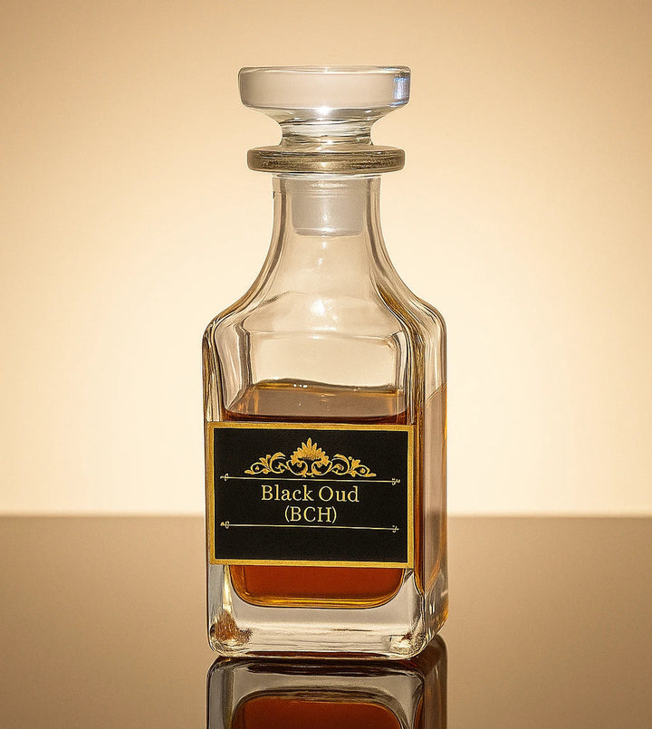 Glass bottle labeled 'Black Oud (BCH)' on a reflective surface with a gradient background