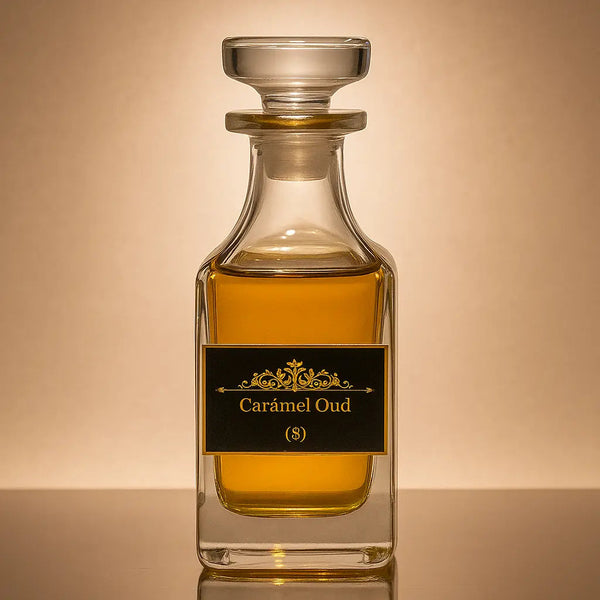 Glass bottle of Caramel Oud perfume on a reflective surface with a beige background